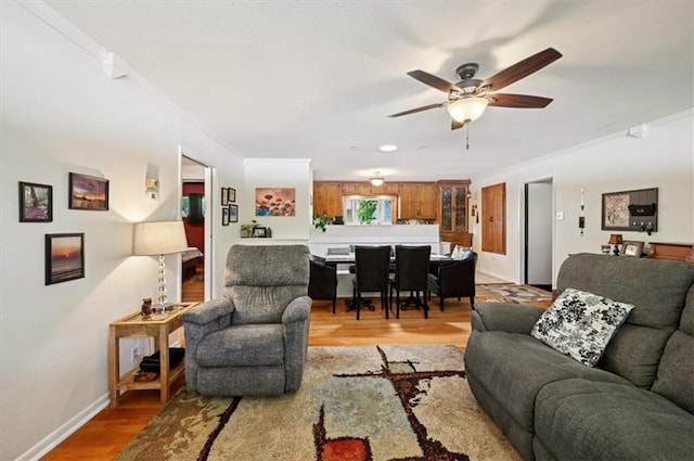 3118 10th Ave, Leavenworth, KS 66048 - living area featuring crown molding, a ceiling fan, and light wood finished floors