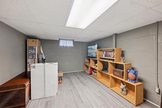 3118 10th Ave, Leavenworth, KS 66048 - basement with a drop ceiling, wood finished floors, and concrete block wall