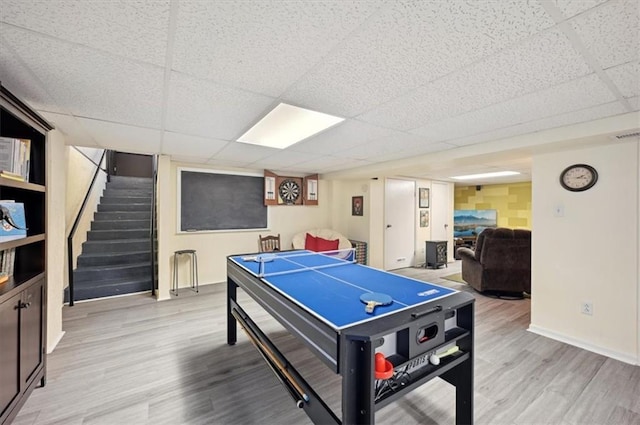 3118 10th Ave, Leavenworth, KS 66048 - recreation room with wood finished floors and a drop ceiling