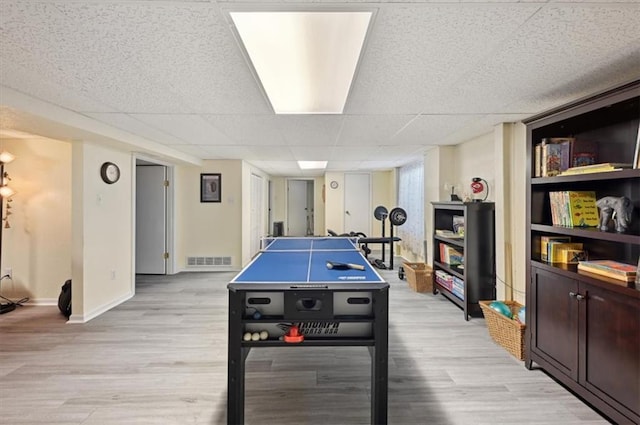 3118 10th Ave, Leavenworth, KS 66048 - rec room featuring a paneled ceiling and light wood-style flooring