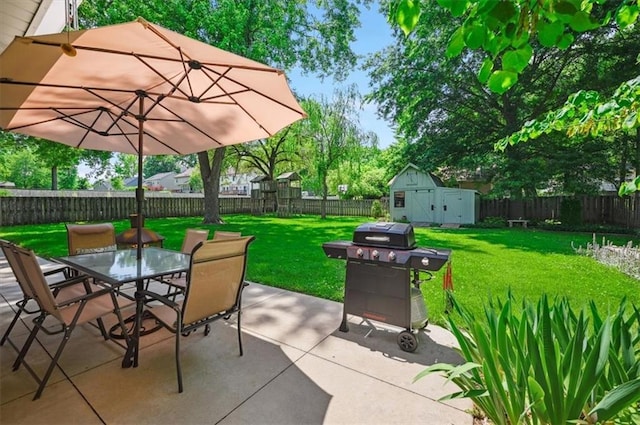 3118 10th Ave, Leavenworth, KS 66048 - fenced backyard with outdoor dining space, area for grilling, a patio, and a shed