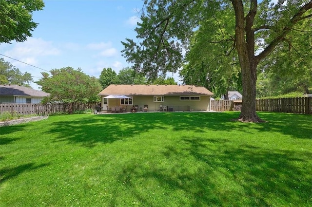 3118 10th Ave, Leavenworth, KS 66048 - rear view of property with a fenced backyard and a patio area
