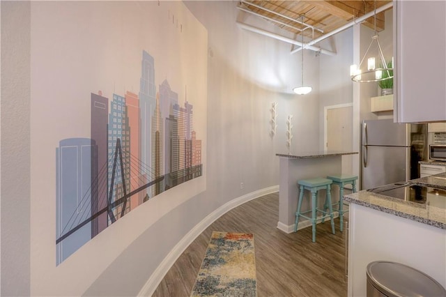 308 W 8th St Unit 420, Kansas City, MO 64105 - hall with a towering ceiling and wood finished floors