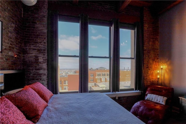308 W 8th St Unit 420, Kansas City, MO 64105 - bedroom with multiple windows, brick wall, and beam ceiling