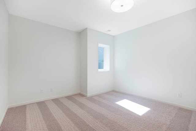 2412 W 177th St, Overland Park, KS 66085 - unfurnished room with light colored carpet and baseboards