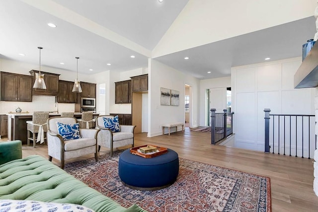 2412 W 177th St, Overland Park, KS 66085 - living room with light wood-style flooring, recessed lighting, and vaulted ceiling