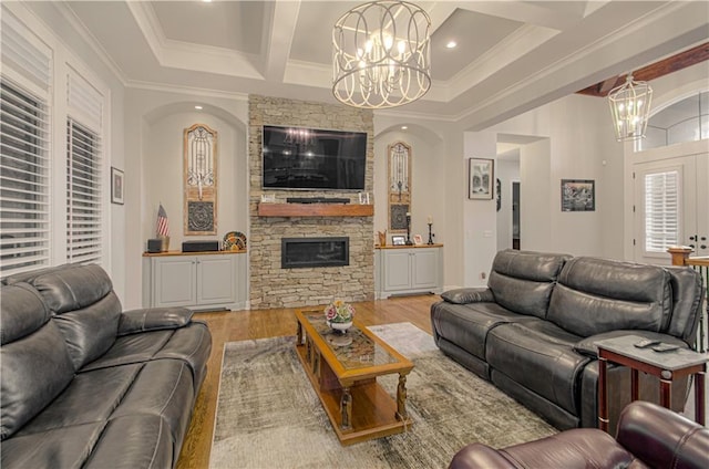 10423 W 168th Ter, Overland Park, KS 66221 - living area with a chandelier, wood finished floors, ornamental molding, a fireplace, and beamed ceiling