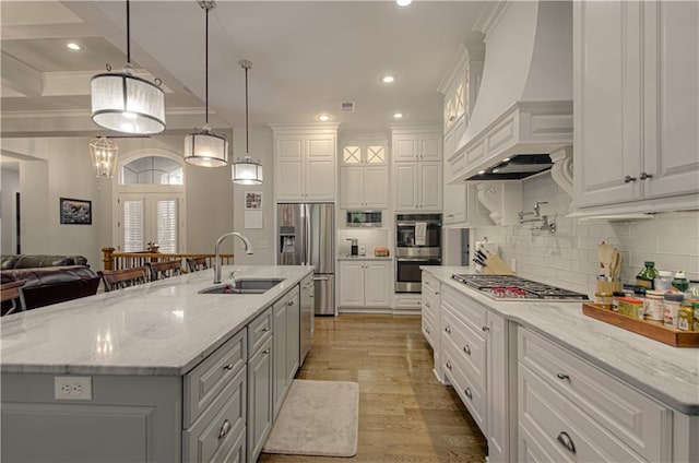 10423 W 168th Ter, Overland Park, KS 66221 - kitchen featuring stainless steel appliances, premium range hood, gray cabinetry, white cabinetry, and ornamental molding