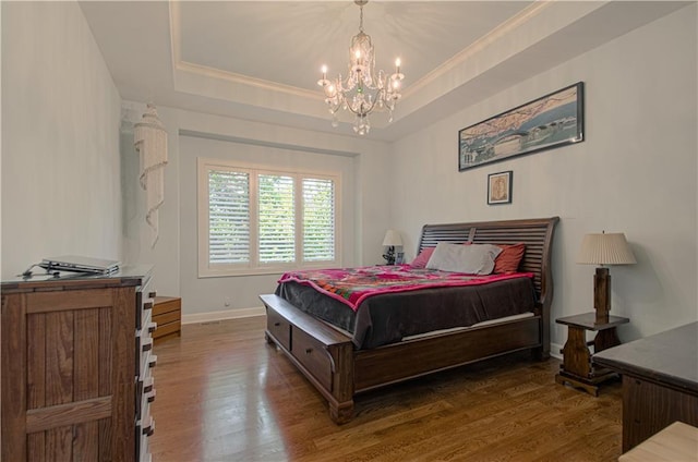 10423 W 168th Ter, Overland Park, KS 66221 - bedroom featuring a chandelier, ornamental molding, wood finished floors, and a tray ceiling