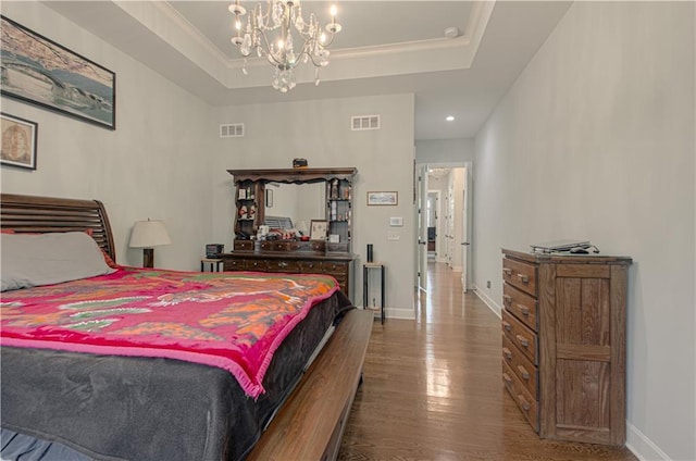 10423 W 168th Ter, Overland Park, KS 66221 - bedroom with wood finished floors, a chandelier, recessed lighting, and a tray ceiling