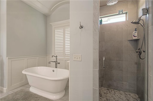 10423 W 168th Ter, Overland Park, KS 66221 - full bath with a shower stall, a freestanding tub, a decorative wall, a wainscoted wall, and tile patterned floors