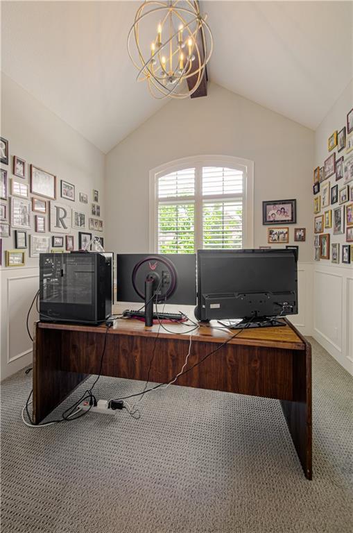 10423 W 168th Ter, Overland Park, KS 66221 - office area with a chandelier, light carpet, vaulted ceiling, a wainscoted wall, and a decorative wall