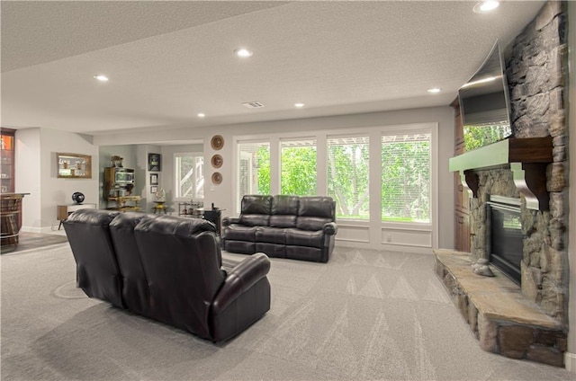 10423 W 168th Ter, Overland Park, KS 66221 - living room featuring light carpet, a fireplace, a textured ceiling, and recessed lighting