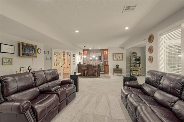 10423 W 168th Ter, Overland Park, KS 66221 - living area featuring bar area, light carpet, a textured ceiling, and recessed lighting
