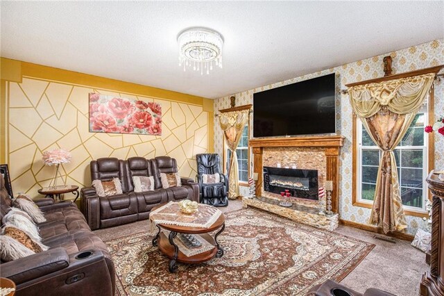 4407 SW Briarbrook Dr, Lees Summit, MO 64082 - living room with wallpapered walls, carpet floors, a glass covered fireplace, a textured ceiling, and a chandelier