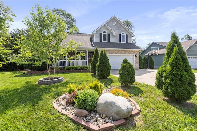 1125 S Mulberry St, Ottawa, KS 66067 - traditional-style home with concrete driveway, a front yard, a garage, and a shingled roof