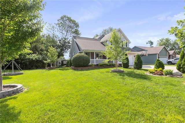 1125 S Mulberry St, Ottawa, KS 66067 - view of front facade with a front lawn, driveway, and a garage