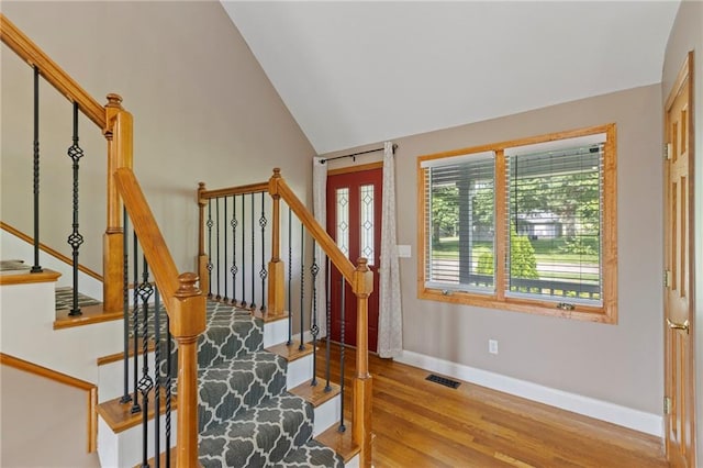 1125 S Mulberry St, Ottawa, KS 66067 - staircase with wood finished floors and lofted ceiling