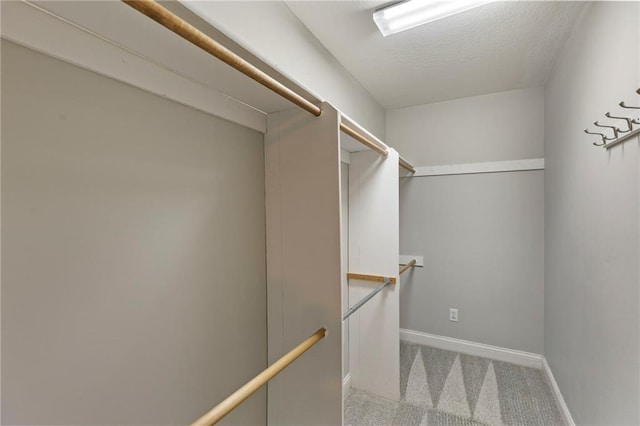 1125 S Mulberry St, Ottawa, KS 66067 - walk in closet featuring carpet
