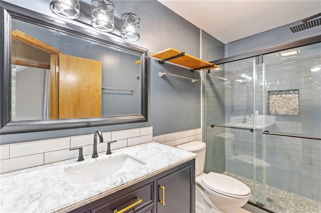 1125 S Mulberry St, Ottawa, KS 66067 - bathroom featuring vanity, a stall shower, and tile walls