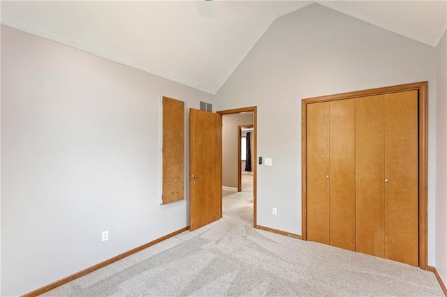 1125 S Mulberry St, Ottawa, KS 66067 - unfurnished bedroom featuring light carpet, a closet, and high vaulted ceiling