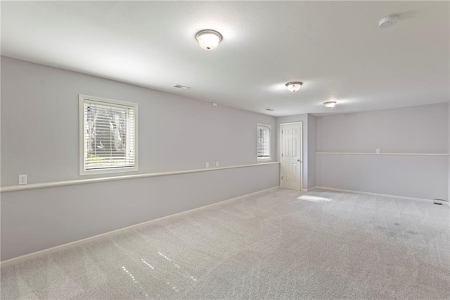 1125 S Mulberry St, Ottawa, KS 66067 - carpeted spare room with healthy amount of natural light and a smoke detector