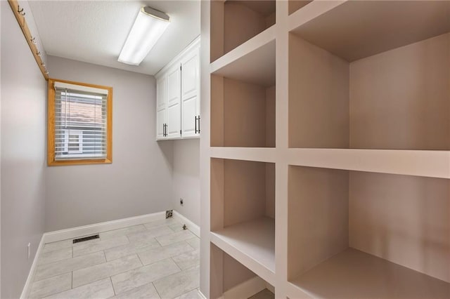 1125 S Mulberry St, Ottawa, KS 66067 - laundry area with electric dryer hookup and cabinet space
