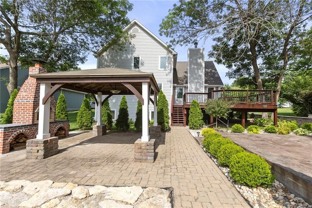 1125 S Mulberry St, Ottawa, KS 66067 - view of patio / terrace with a gazebo, a deck, and stairs
