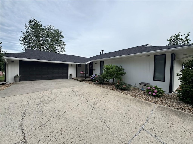 109 W 3rd St, Stanberry, MO 64489 - ranch-style house with concrete driveway and a garage