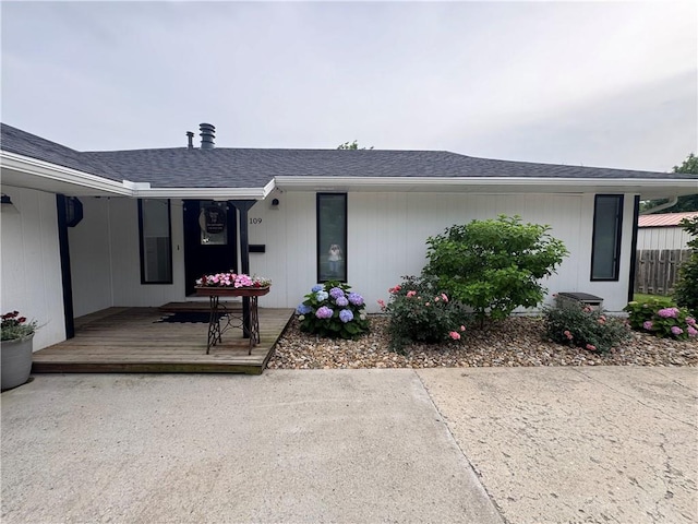 109 W 3rd St, Stanberry, MO 64489 - view of front of house featuring covered porch and a shingled roof