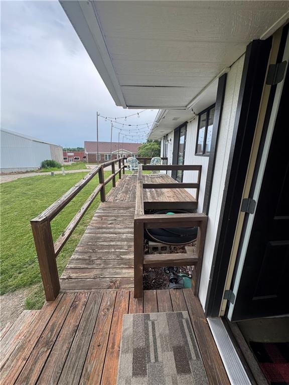 109 W 3rd St, Stanberry, MO 64489 - wooden terrace featuring a lawn