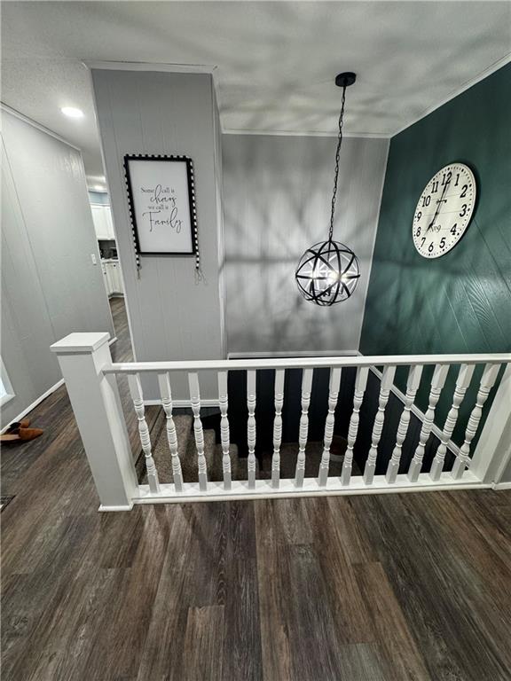 109 W 3rd St, Stanberry, MO 64489 - staircase with wood finished floors and a chandelier