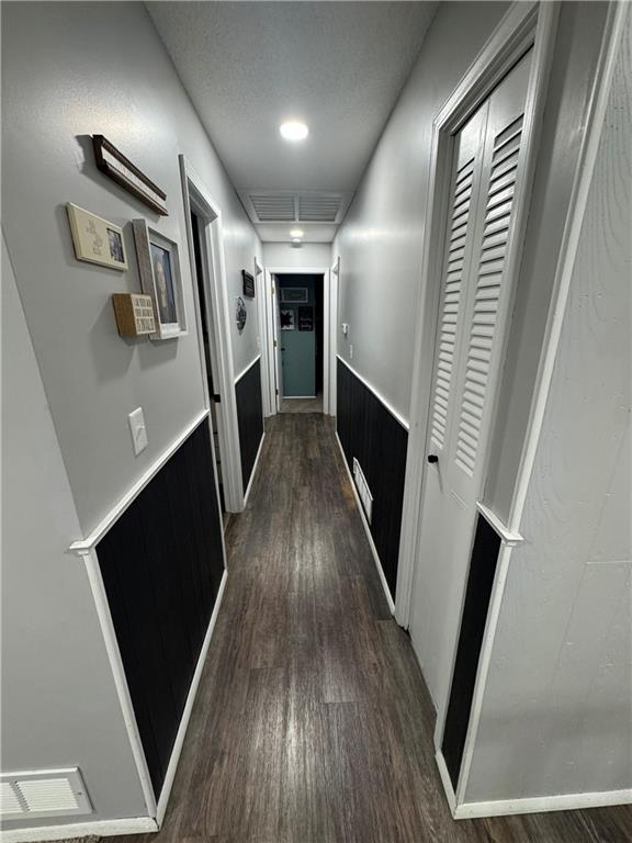 109 W 3rd St, Stanberry, MO 64489 - hall with dark wood-type flooring