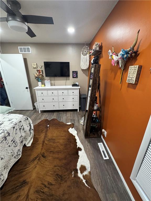 109 W 3rd St, Stanberry, MO 64489 - bedroom featuring dark wood-style flooring and a ceiling fan