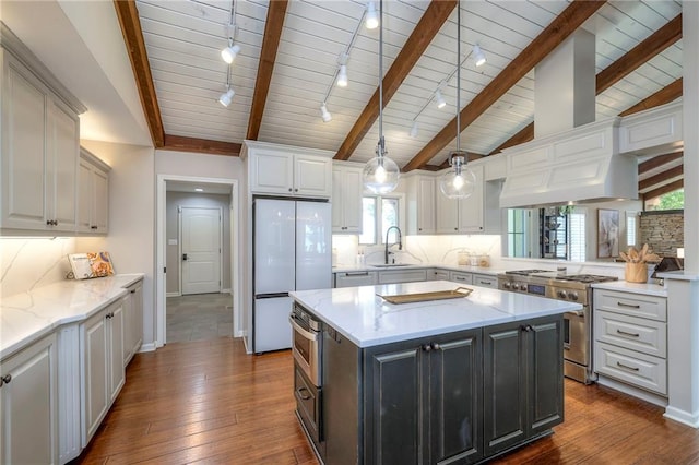 6 Mohave Dr, Lake Winnebago, MO 64034 - kitchen with appliances with stainless steel finishes, wood ceiling, dark wood-style floors, white cabinets, and a center island