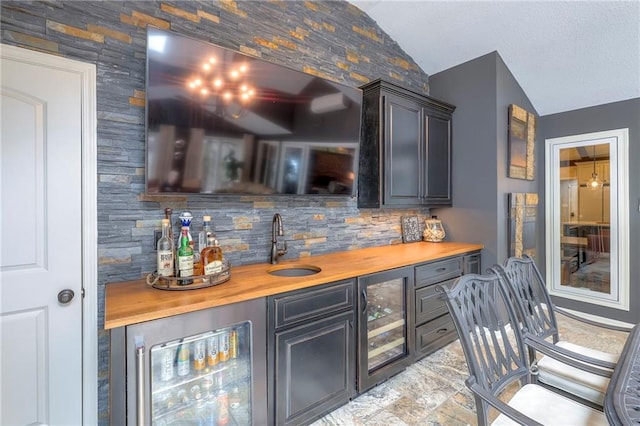 6 Mohave Dr, Lake Winnebago, MO 64034 - indoor wet bar with beverage cooler, lofted ceiling, and backsplash