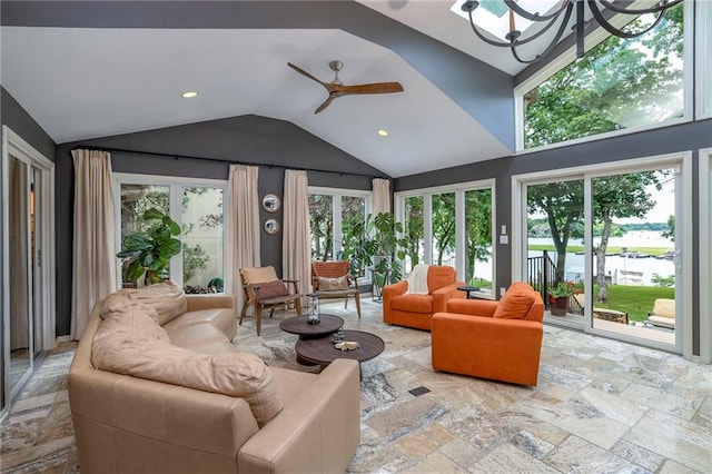 6 Mohave Dr, Lake Winnebago, MO 64034 - living room featuring vaulted ceiling, plenty of natural light, ceiling fan, recessed lighting, and a chandelier