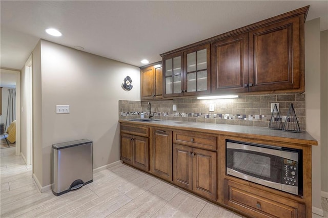 6 Mohave Dr, Lake Winnebago, MO 64034 - bar featuring stainless steel microwave, tasteful backsplash, and recessed lighting