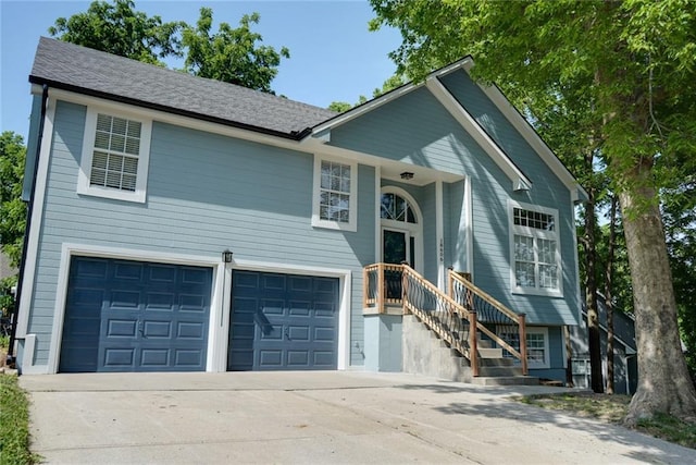 18606 E 20th Ter N, Independence, MO 64058 - split foyer home featuring a garage and concrete driveway