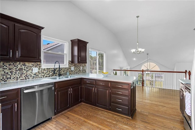 16778 W 156th Ter, Olathe, KS 66062 - kitchen featuring dishwasher, light countertops, a peninsula, light wood finished floors, and a chandelier