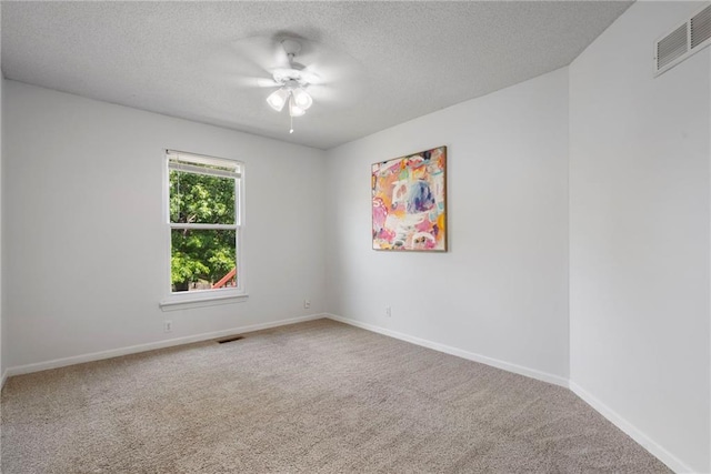 16778 W 156th Ter, Olathe, KS 66062 - spare room with a textured ceiling, carpet, and a ceiling fan