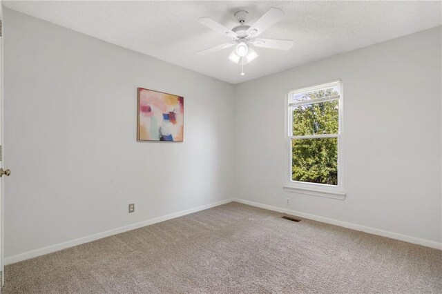 16778 W 156th Ter, Olathe, KS 66062 - spare room with carpet, a ceiling fan, and a textured ceiling