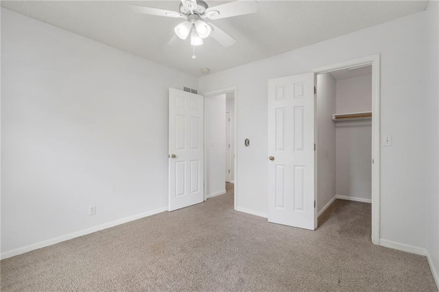 16778 W 156th Ter, Olathe, KS 66062 - unfurnished bedroom with carpet floors, a walk in closet, a closet, and ceiling fan