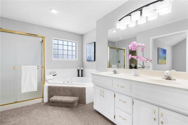 16778 W 156th Ter, Olathe, KS 66062 - full bathroom with a shower stall, double vanity, a garden tub, a textured ceiling, and recessed lighting