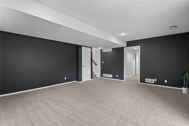 16778 W 156th Ter, Olathe, KS 66062 - carpeted empty room featuring a textured ceiling, stairs, and recessed lighting