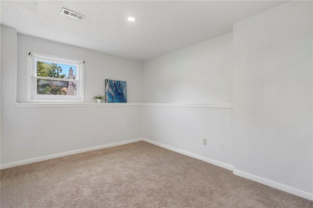 16778 W 156th Ter, Olathe, KS 66062 - spare room with carpet floors, a textured ceiling, and recessed lighting