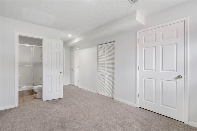 16778 W 156th Ter, Olathe, KS 66062 - unfurnished bedroom with carpet flooring, a textured ceiling, ensuite bath, and recessed lighting