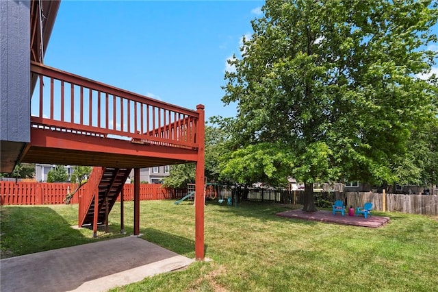 16778 W 156th Ter, Olathe, KS 66062 - fenced backyard featuring a playground, a patio, a deck, and stairs