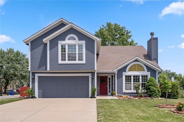 16778 W 156th Ter, Olathe, KS 66062 - view of front facade featuring driveway, an attached garage, a front yard, and a chimney