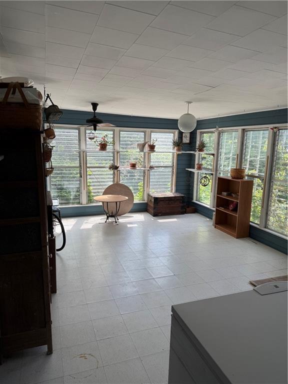 222 W Gay St, Warrensburg, MO 64093 - sunroom / solarium featuring plenty of natural light and tile patterned floors